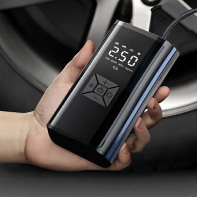 Mini compresseur voiture tient dans la main