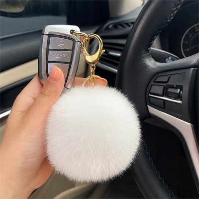 porte clés pompon blanc